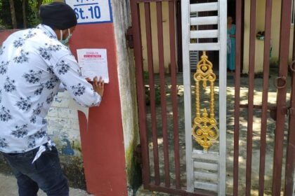 Marking the houses of positive patients living in home isolation…. Corporation workers are putting stickers outside homes