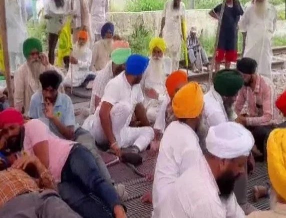 In Punjab, sugarcane farmers sitting on rail tracks, warned the government
