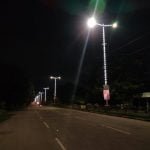 The main road of the township illuminated with colorful beautiful colorful lights